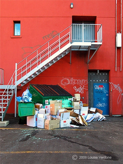 Garbage and Orange Wall