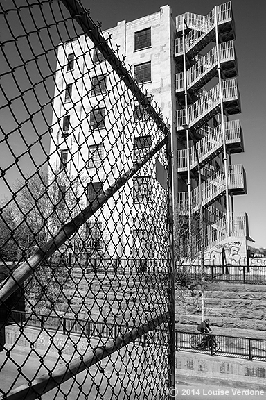 Fence, Cyclist and Building