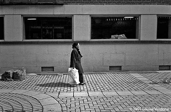 Woman with Bag and Man with Newspaper