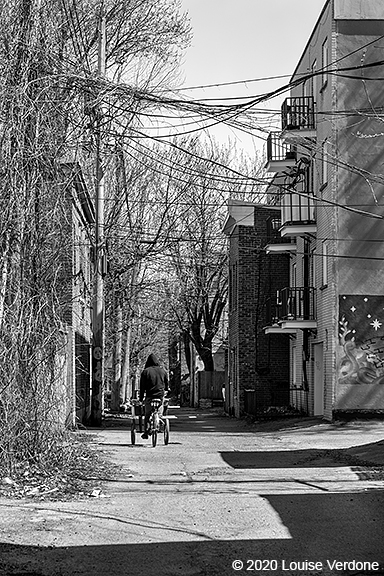 Delivery Cyclist in a Lane