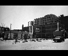 Woman, Seated Man and Car